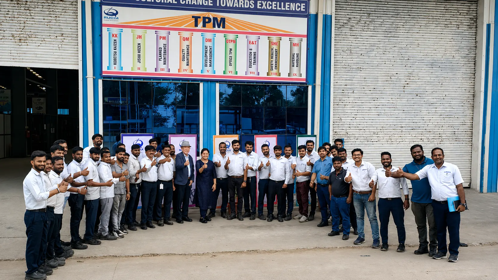 Group briefing beside production machinery during a plant tour